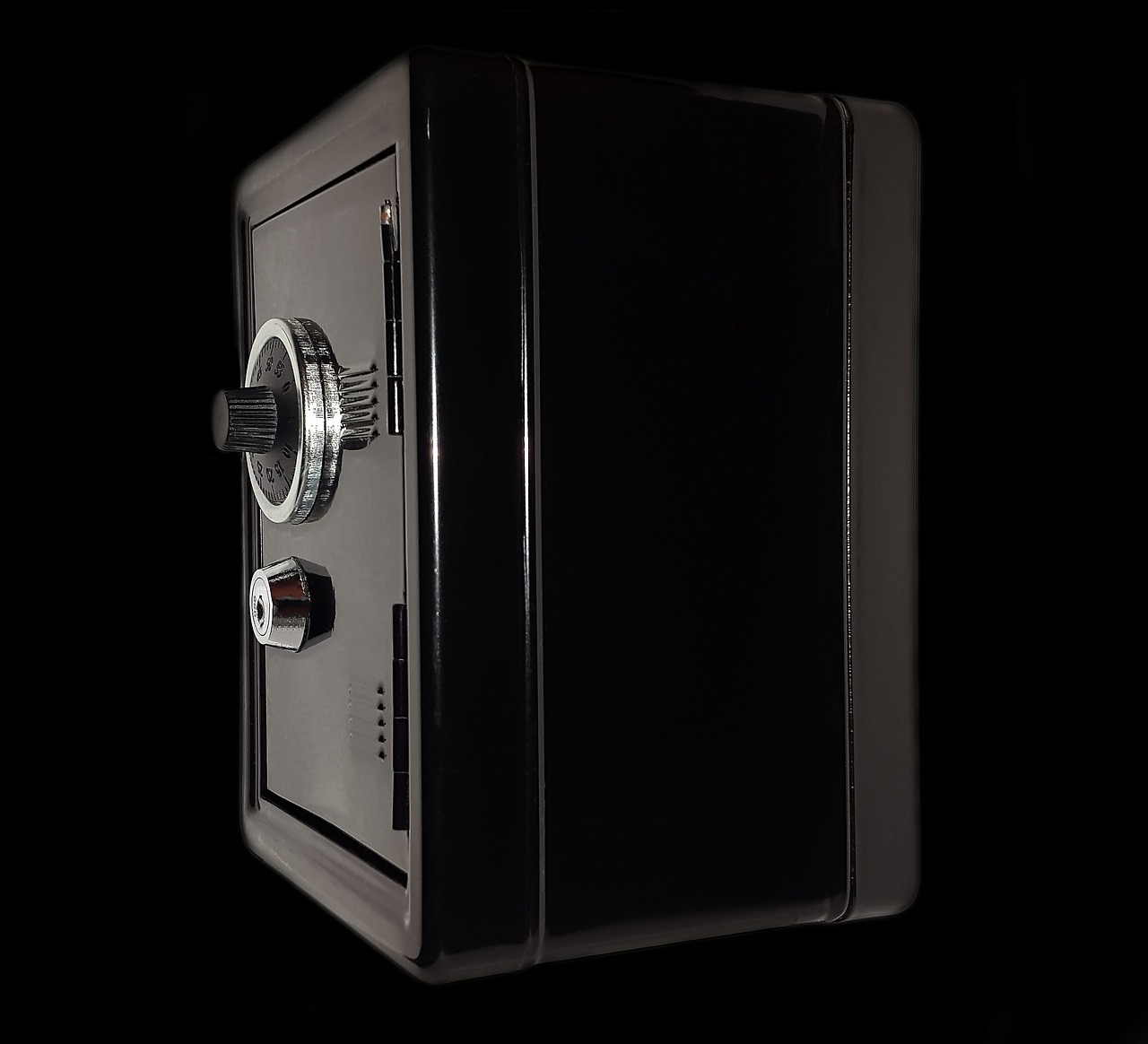 Box spread options concept: a small black steel safe with a combination dial, like a position locked to a fixed payoff