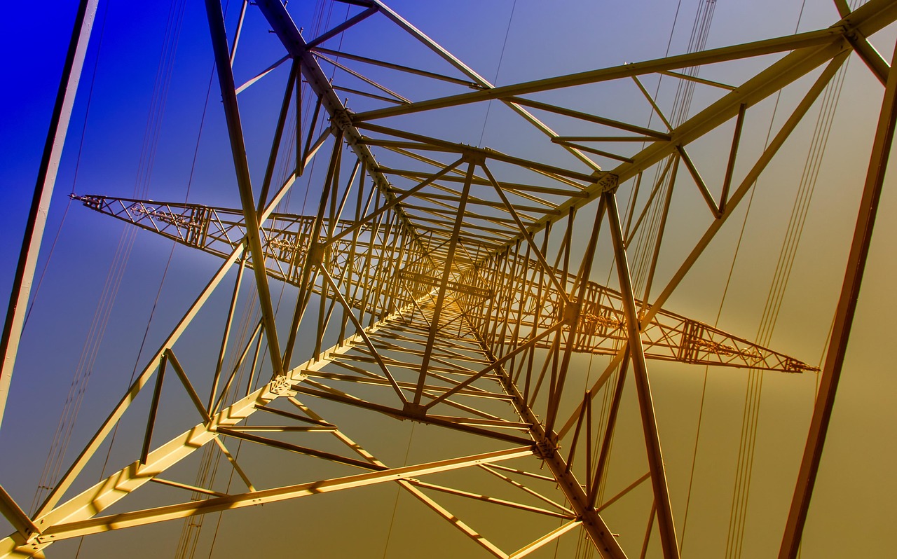 Karamtara Engineering credit rating: steel lattice of an electricity transmission tower seen from below