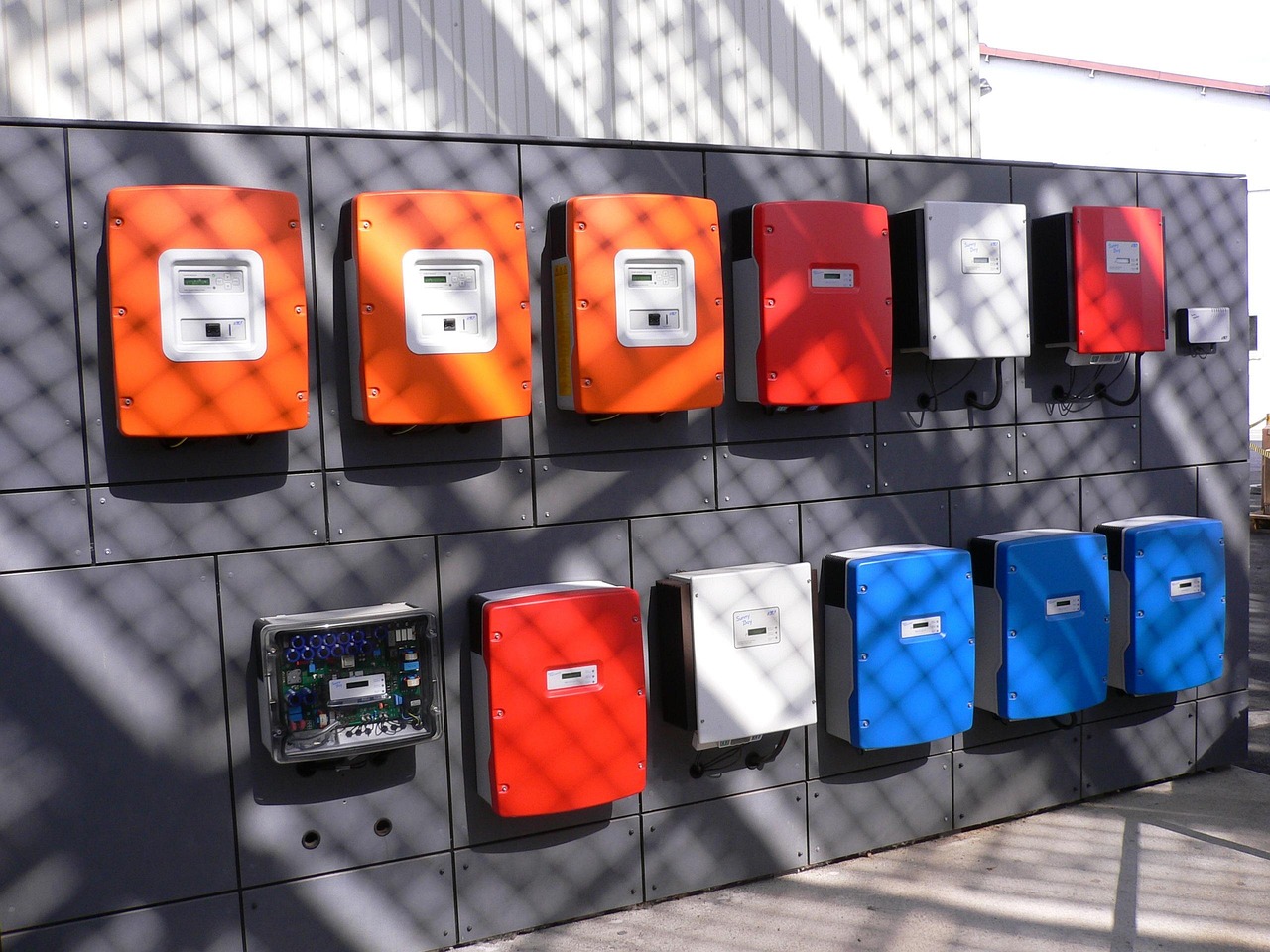 Amber Enterprises share swap: a wall of solar inverters of the kind Power-One makes