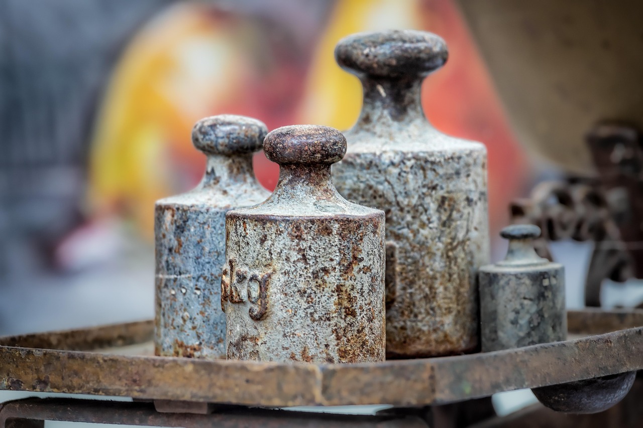 Arbitrage fund: old iron weights resting on a market scale