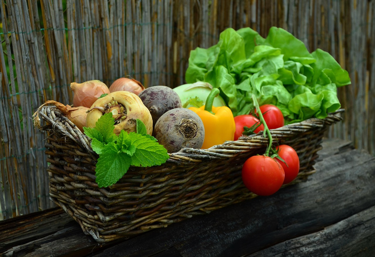 Basket order: a wicker basket holding an assortment of vegetables