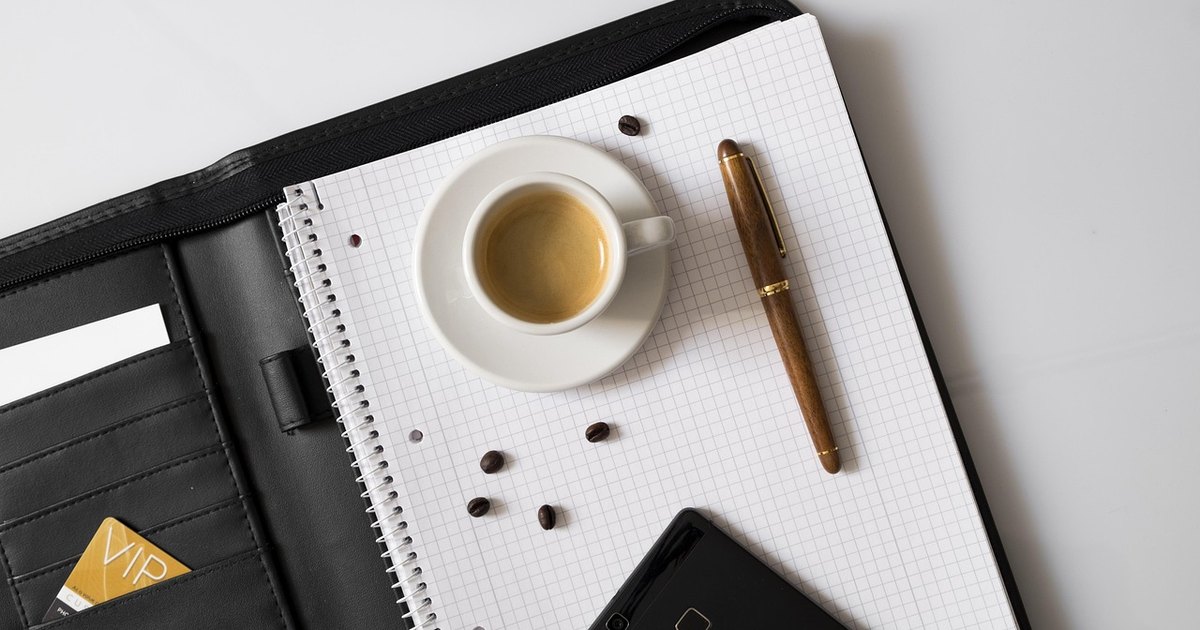 Bear put spread strategy - notebook pen coffee desk
