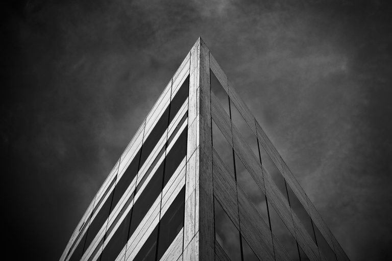 EAAA India Alternatives IPO: modern office building against a cloudy sky