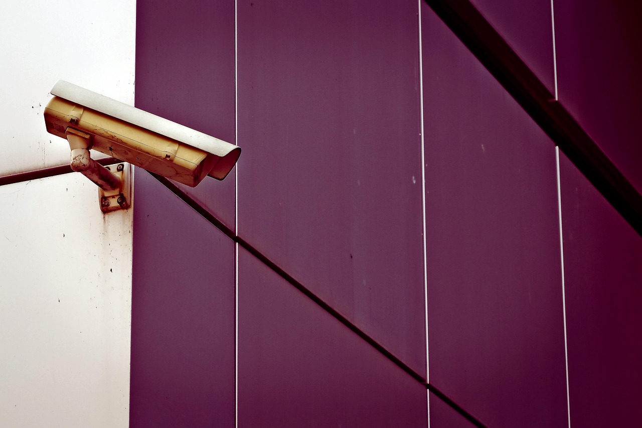 SIS buyback: a surveillance camera mounted on an office building wall