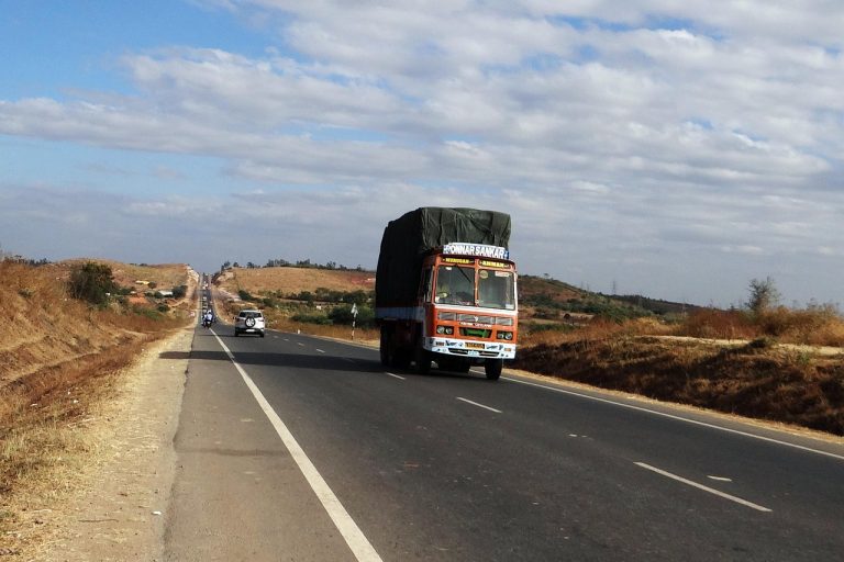 Cholamandalam Investment Q2 results: a loaded truck on an Indian highway, the kind of vehicle the NBFC finances