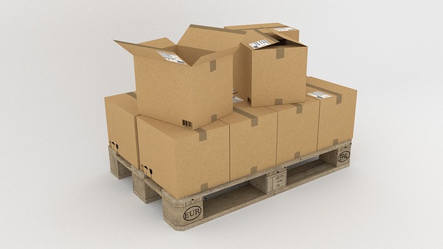 Delhivery Q2 results: cardboard parcels stacked on a wooden pallet