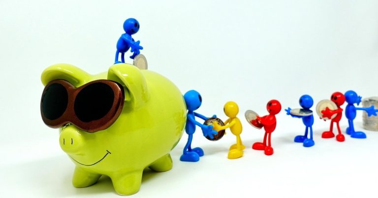 Piggy bank coins representing dividend savings and shareholder cash entitlement