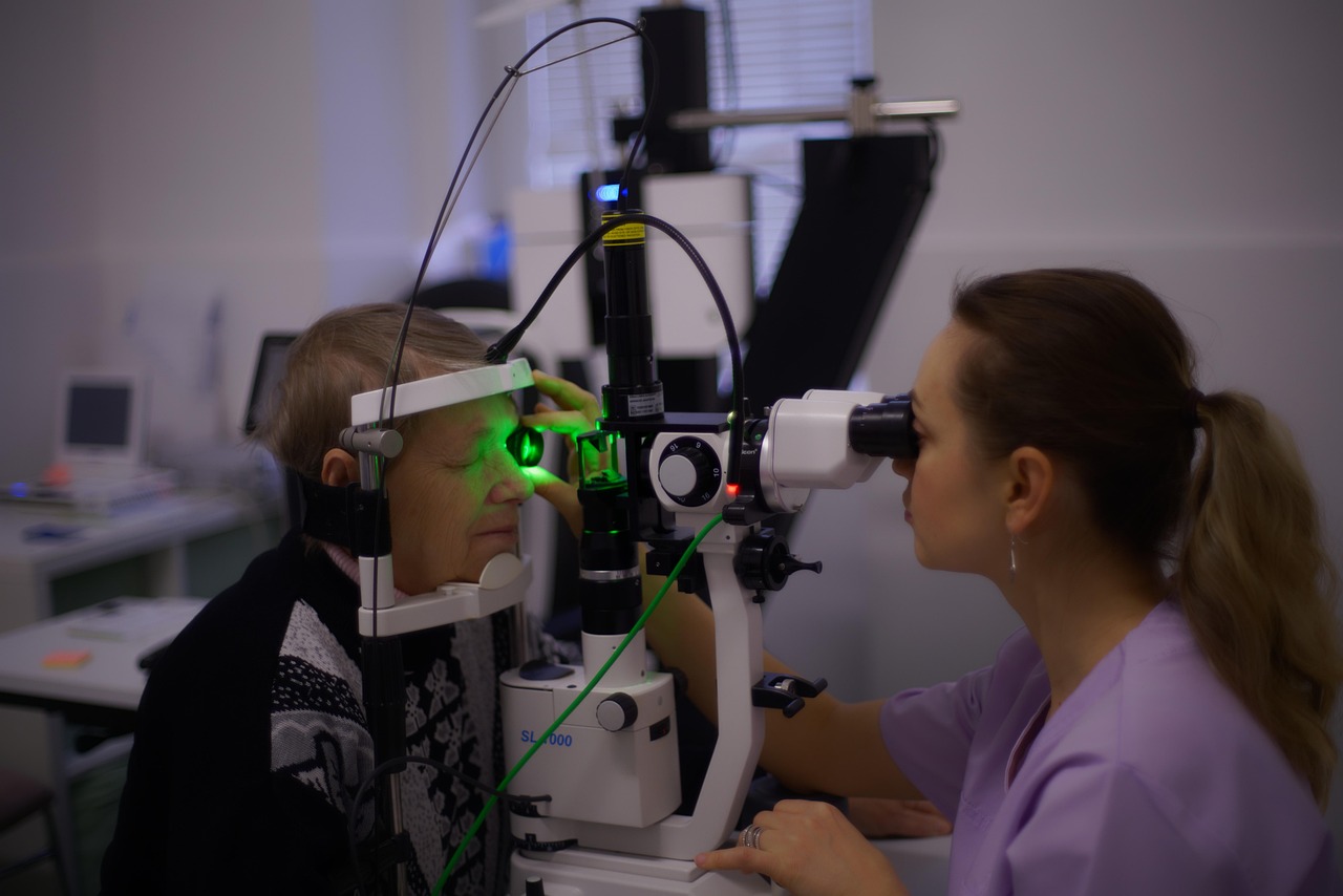 Dr Agarwal's Eye Hospital merger: an ophthalmologist examining a patient's eye with a slit lamp