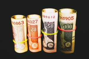 FII DII data October 28: rolled Indian rupee banknotes of different denominations