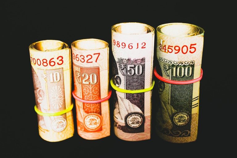 FII DII data October 28: rolled Indian rupee banknotes of different denominations