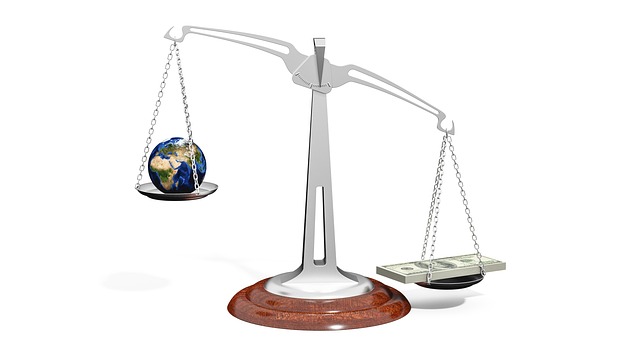 FII DII data October 27: balance scale weighing a globe against a stack of currency notes