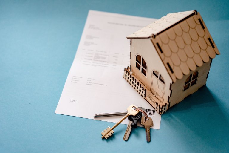 Five-Star Business Finance Q2 results: model house with keys on a loan document, a nod to property-backed lending