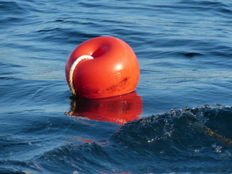 Floater fund concept: an orange buoy floating on rising sea water