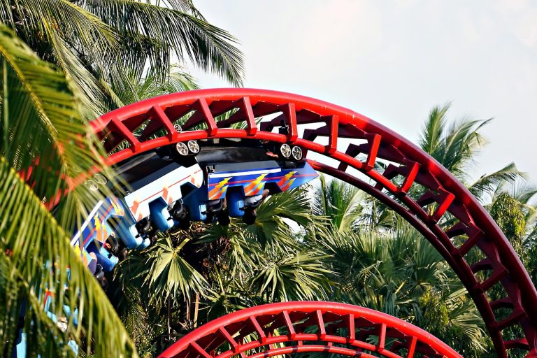 Gamma options greek: a roller coaster train rounding a tight red loop, like delta speeding up near expiry