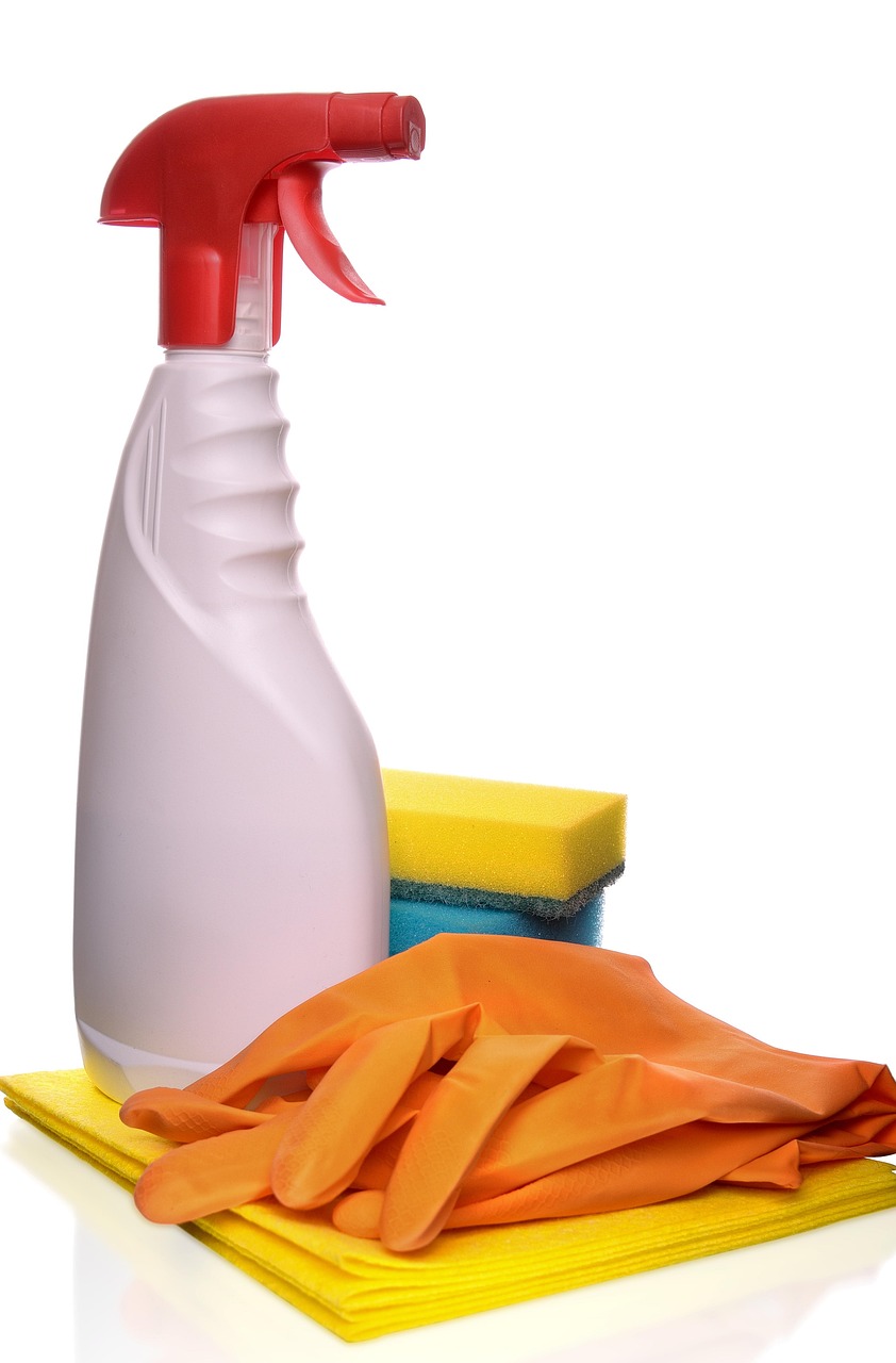 Godrej Consumer Q2 results: a spray bottle, sponge and rubber gloves used for household cleaning