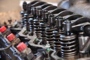 Greaves Cotton Q2 results: close-up of valve springs and rocker arms on an engine cylinder head