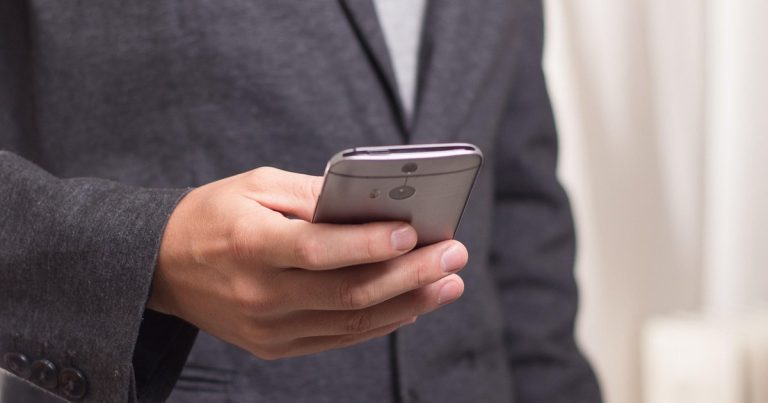 Groww parent Q2 results - smartphone in hand