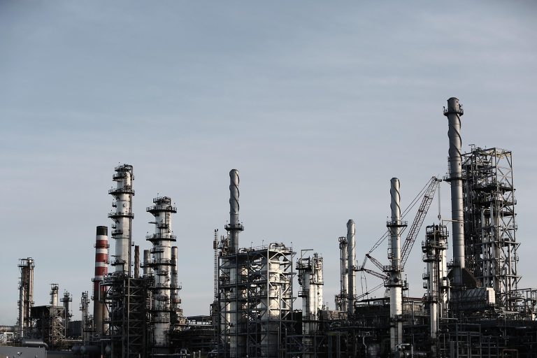 Himadri Speciality Q2 results: steel columns and chimneys of a chemical processing plant against a grey sky
