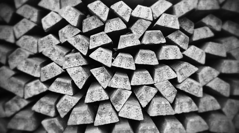 Hindustan Zinc Q2 results: a black and white stack of metal ingots piled in rows