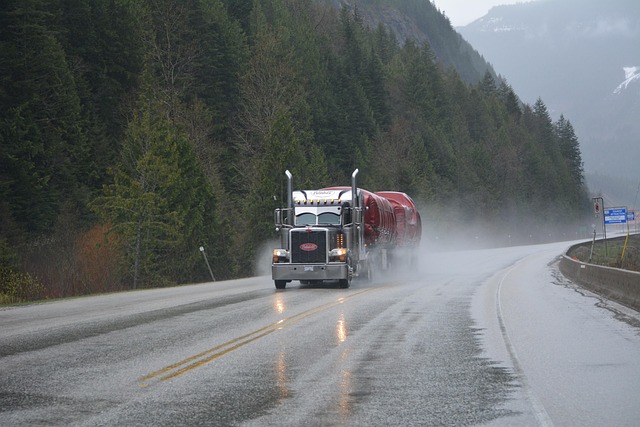 Tata Motors Q2 results: a heavy truck hauling a tanker on a wet mountain highway