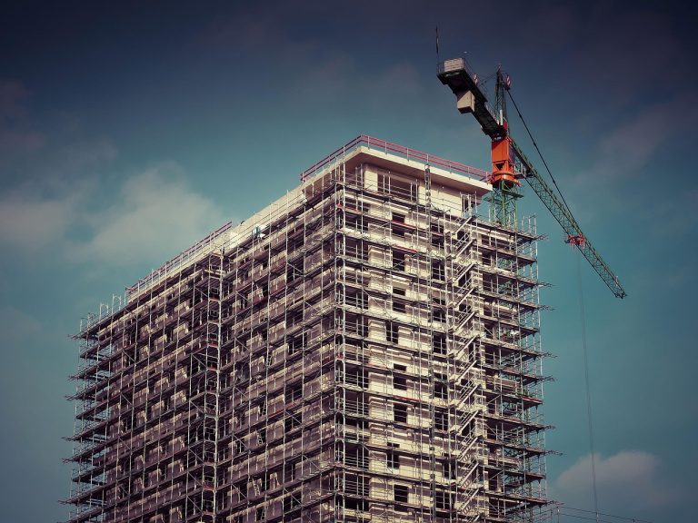 Mahindra Lifespace Q2 results: a residential tower under construction with scaffolding and a crane