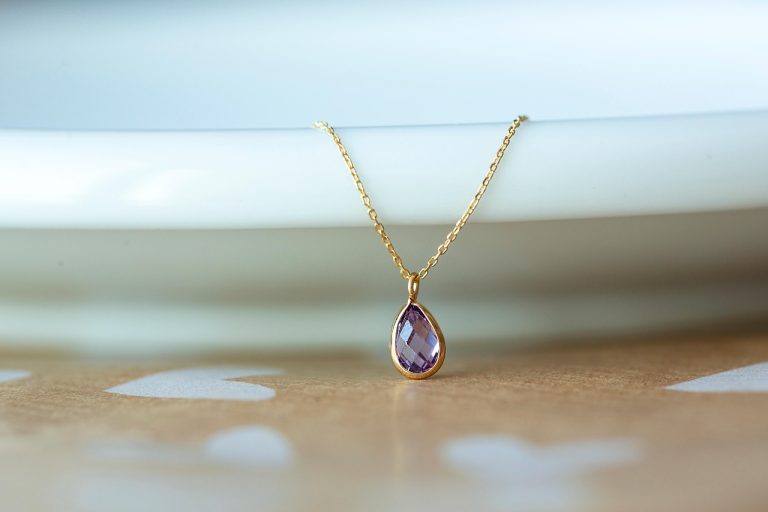 BlueStone Q2 results: a lightweight gold chain necklace with a teardrop gemstone pendant