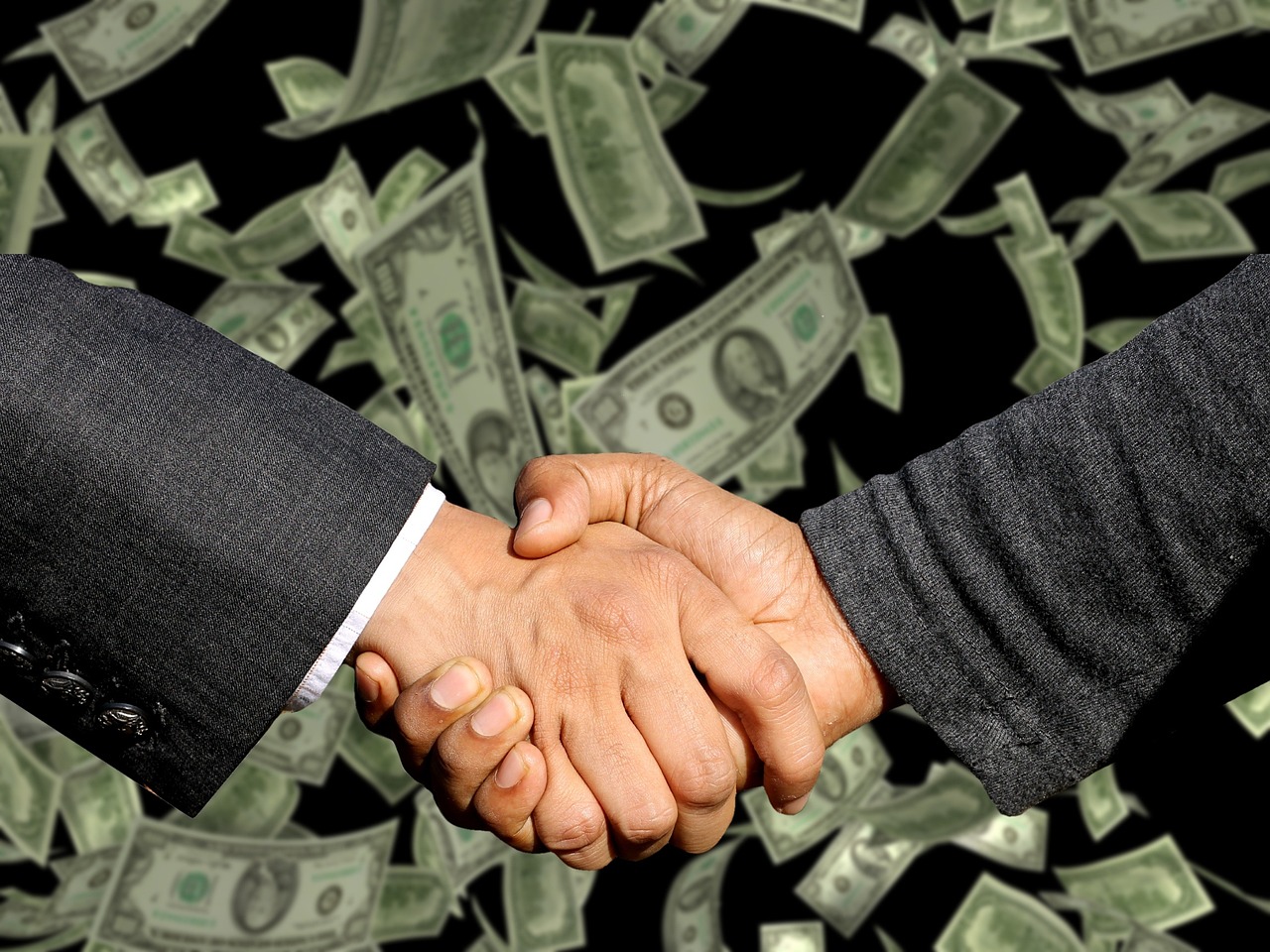 Revenue recognition under Ind AS 115: two people shaking hands on a deal with banknotes falling in the background