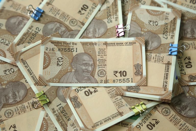 Kotak Mahindra Bank Q2 results: a spread of Indian ten-rupee notes held together with paper clips