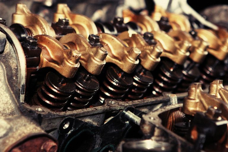 Castrol India Q3 results: close-up of an oil-coated engine valvetrain with springs and rocker arms