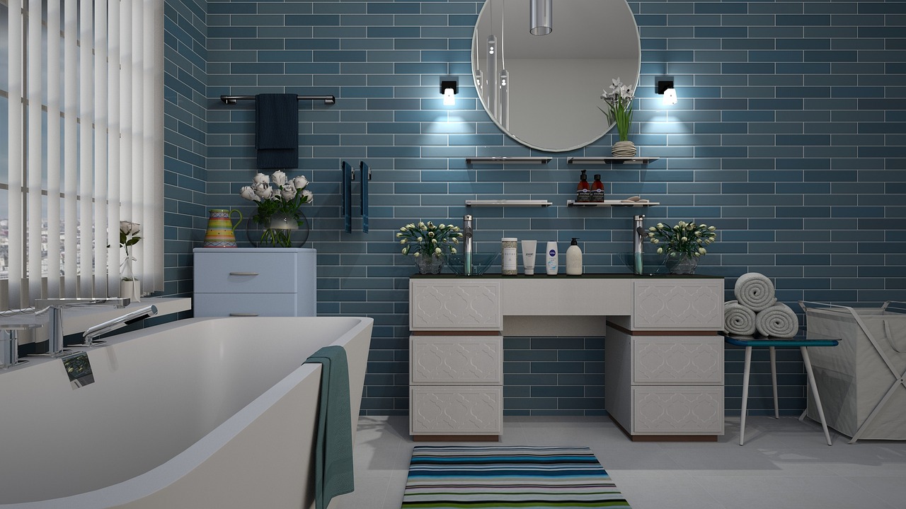 Kajaria Ceramics Q2 results: a modern bathroom with blue glazed wall tiles and a white bathtub