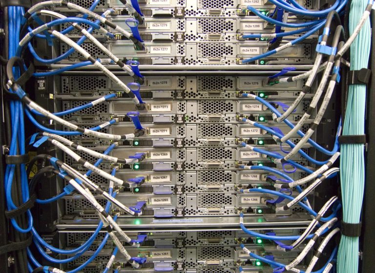 Netweb Technologies Q2 results: rack-mounted servers wired with blue network cables in a data centre