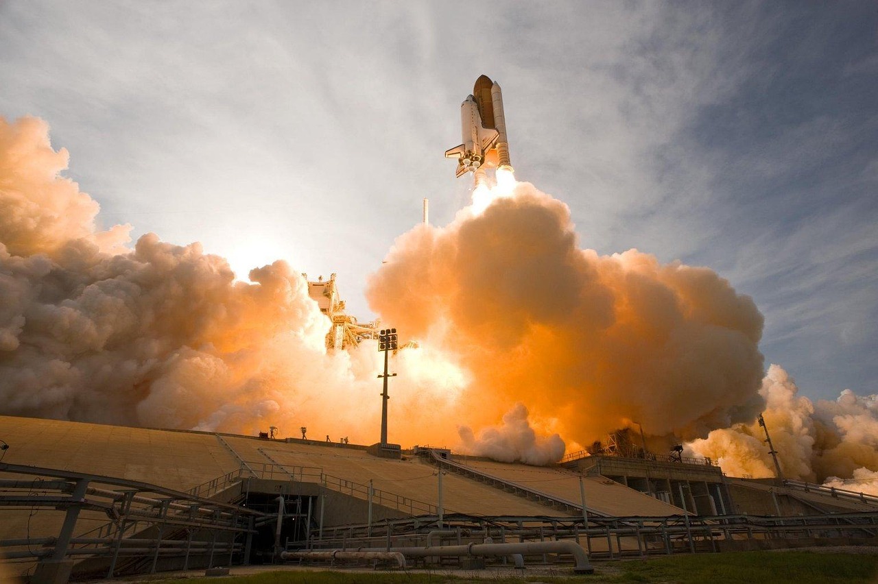 Call ratio backspread concept: a space shuttle lifting off on a column of orange exhaust, standing for a sharp upward move