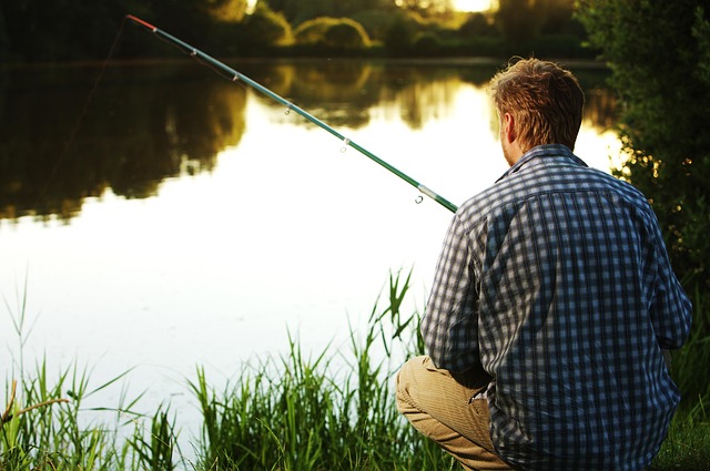 Cash secured put: an angler waiting patiently by a calm lake with a fishing rod, like a put writer waiting for a lower entry price
