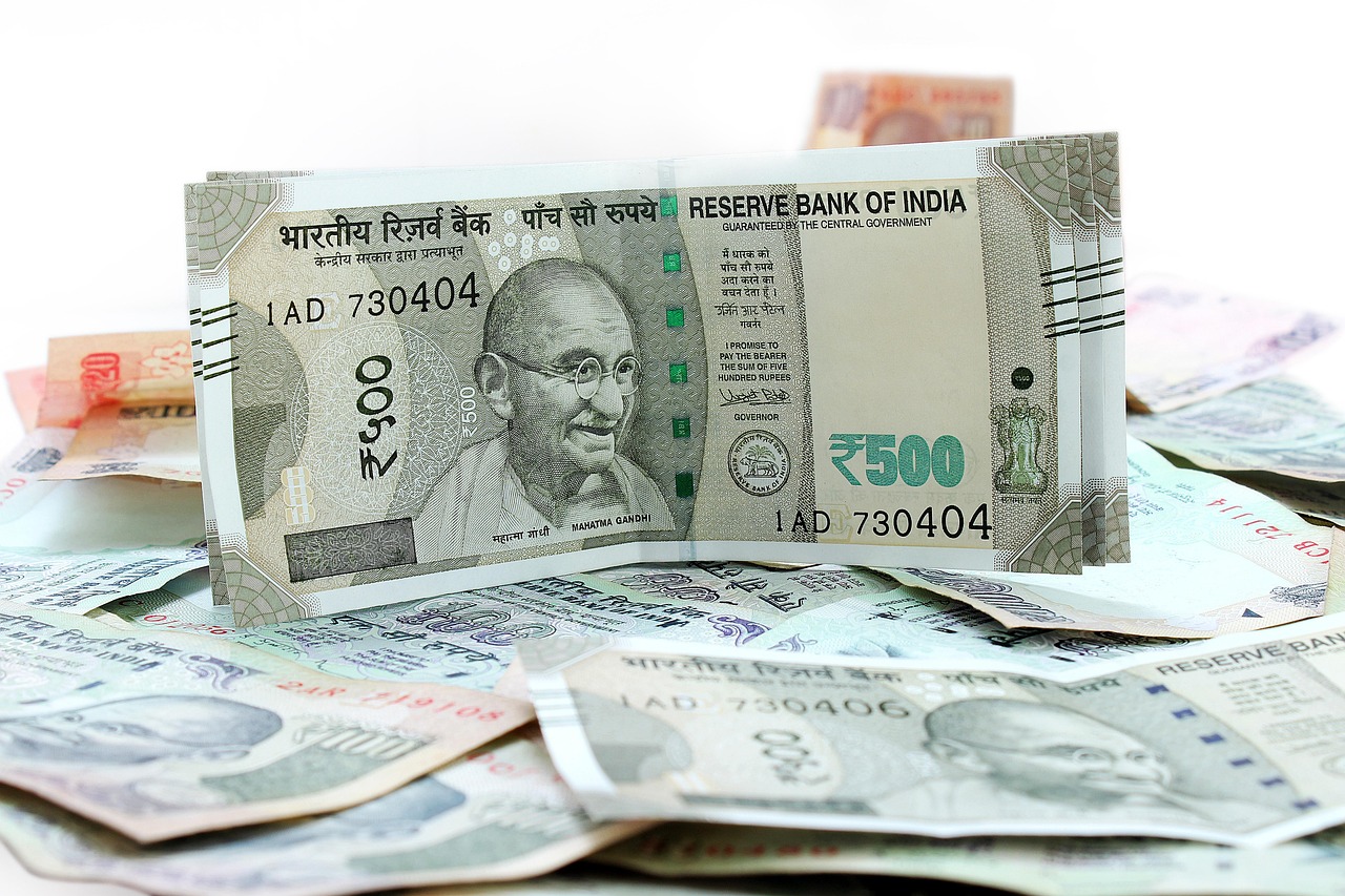 RBI Retail Direct: a fanned stack of Indian rupee banknotes on a white table