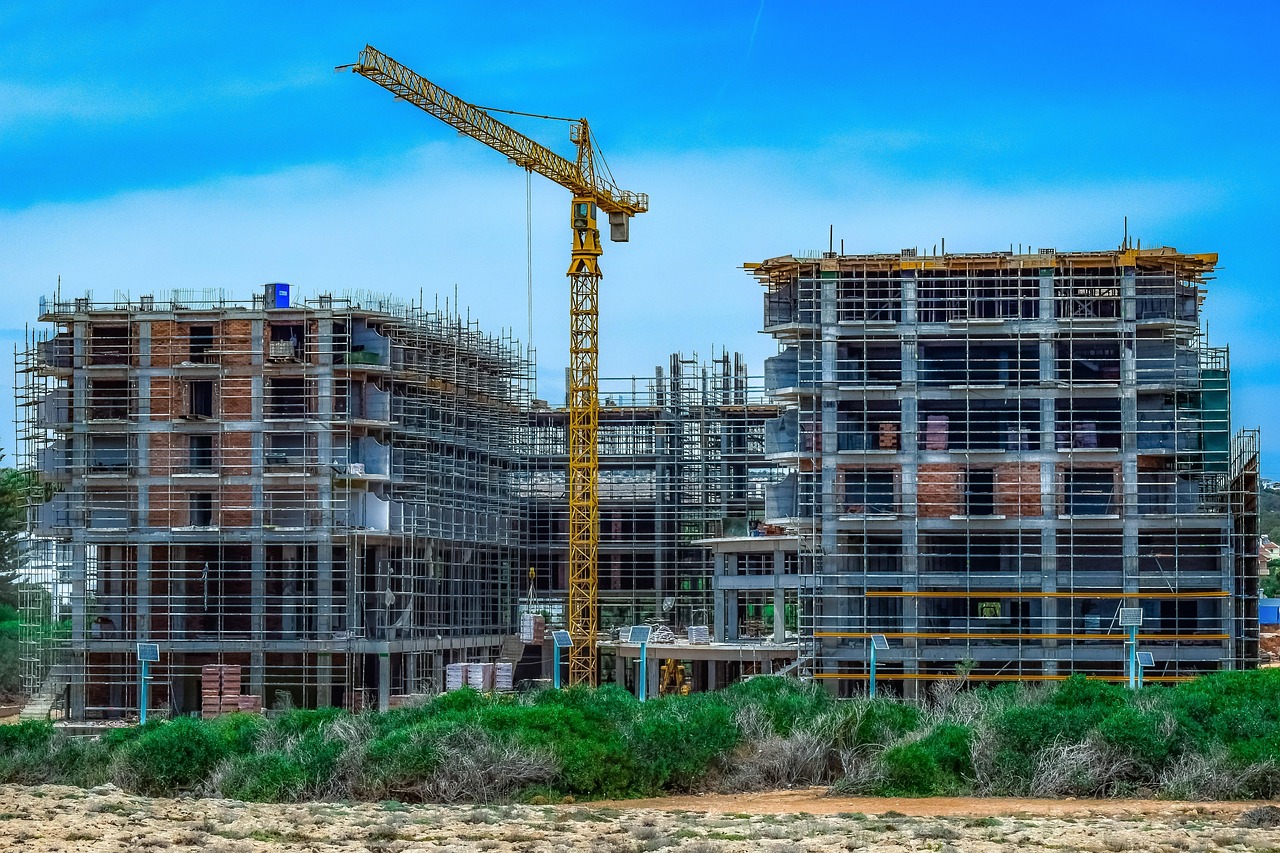 Godrej Properties Q2 results: residential towers under construction with a tower crane