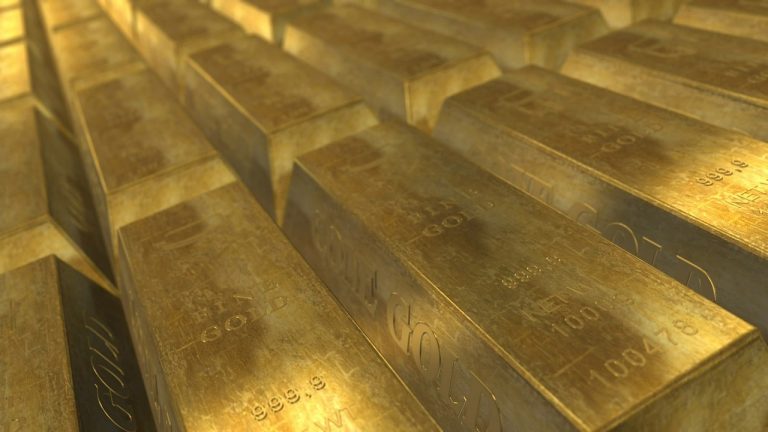 Sovereign gold bond: rows of stacked gold bars under warm light