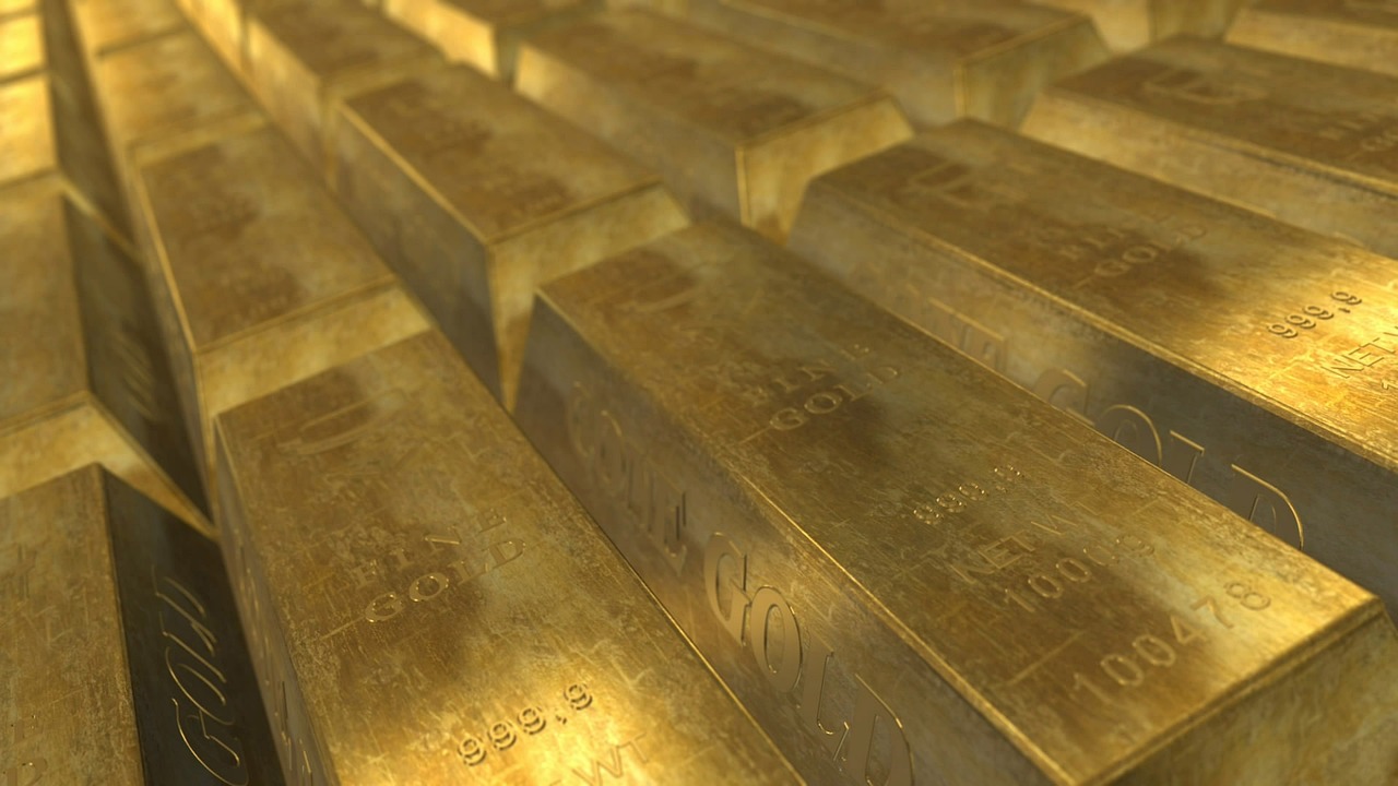 Sovereign gold bond: rows of stacked gold bars under warm light
