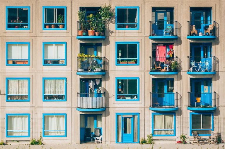 Marathon Nextgen Q2 results: a residential apartment block with blue balconies and windows