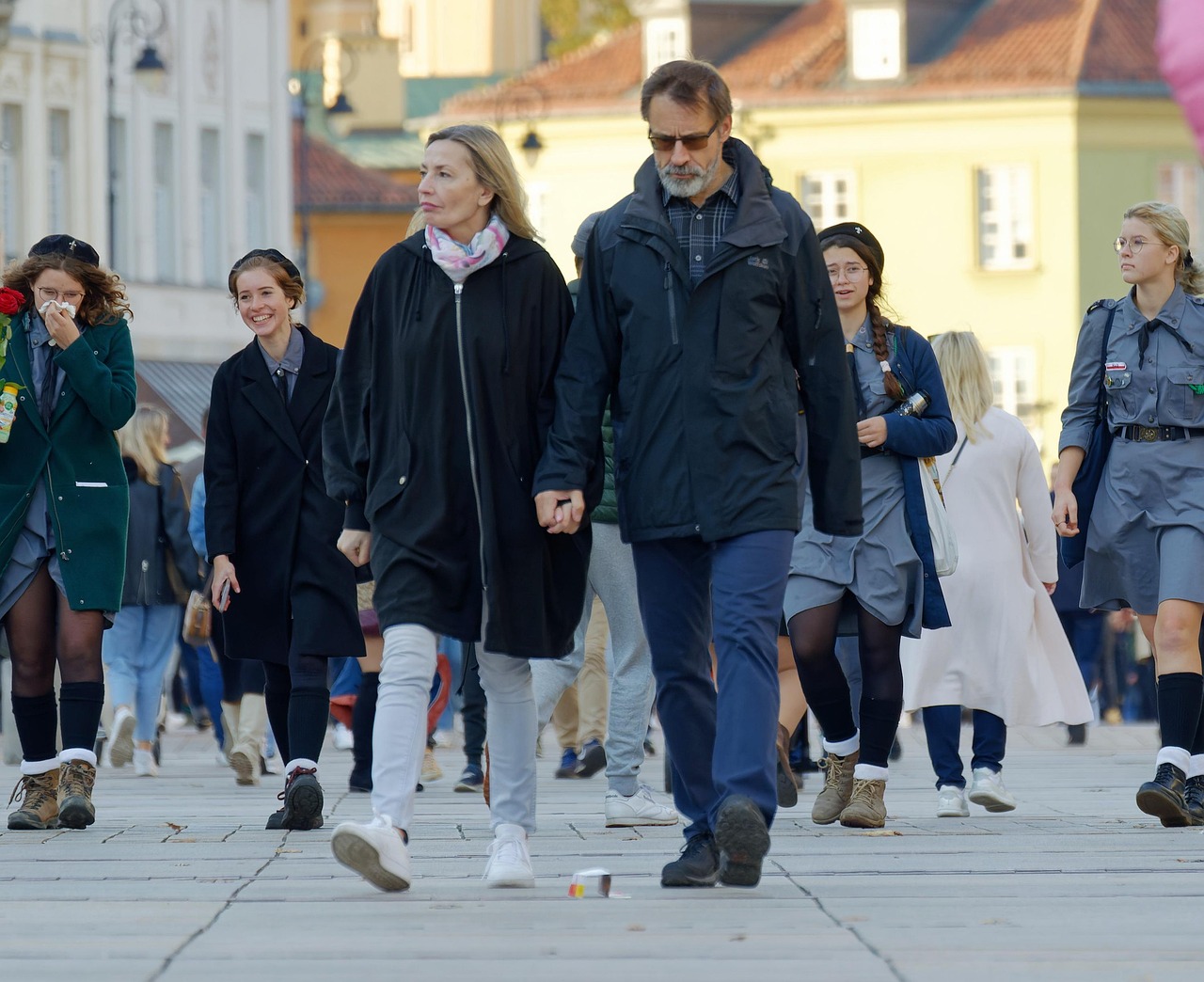 Minimum public shareholding: a crowd of ordinary people walking along a city pavement, standing in for public shareholders