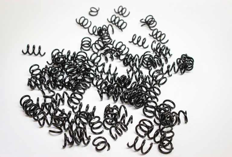 NR7 trading strategy concept: tightly coiled metal springs, like a price range compressing before a breakout
