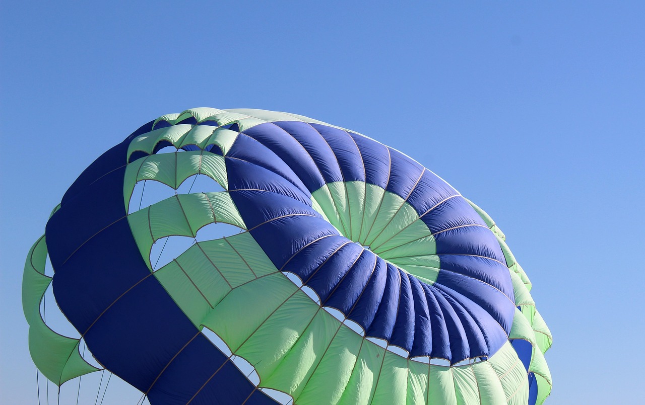 Sortino ratio concept: an open parachute against a clear blue sky, a symbol of protection against downside risk