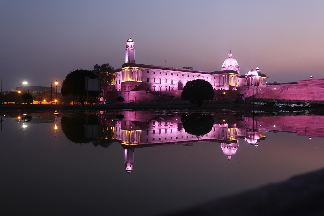 Bharat 22 ETF theme: government secretariat building in New Delhi lit up at dusk and reflected in water