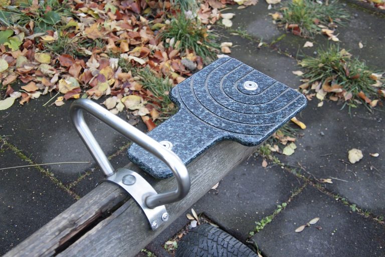 Conversion and reversal arbitrage: the seat of a wooden playground seesaw on autumn leaves, a picture of two sides held in balance