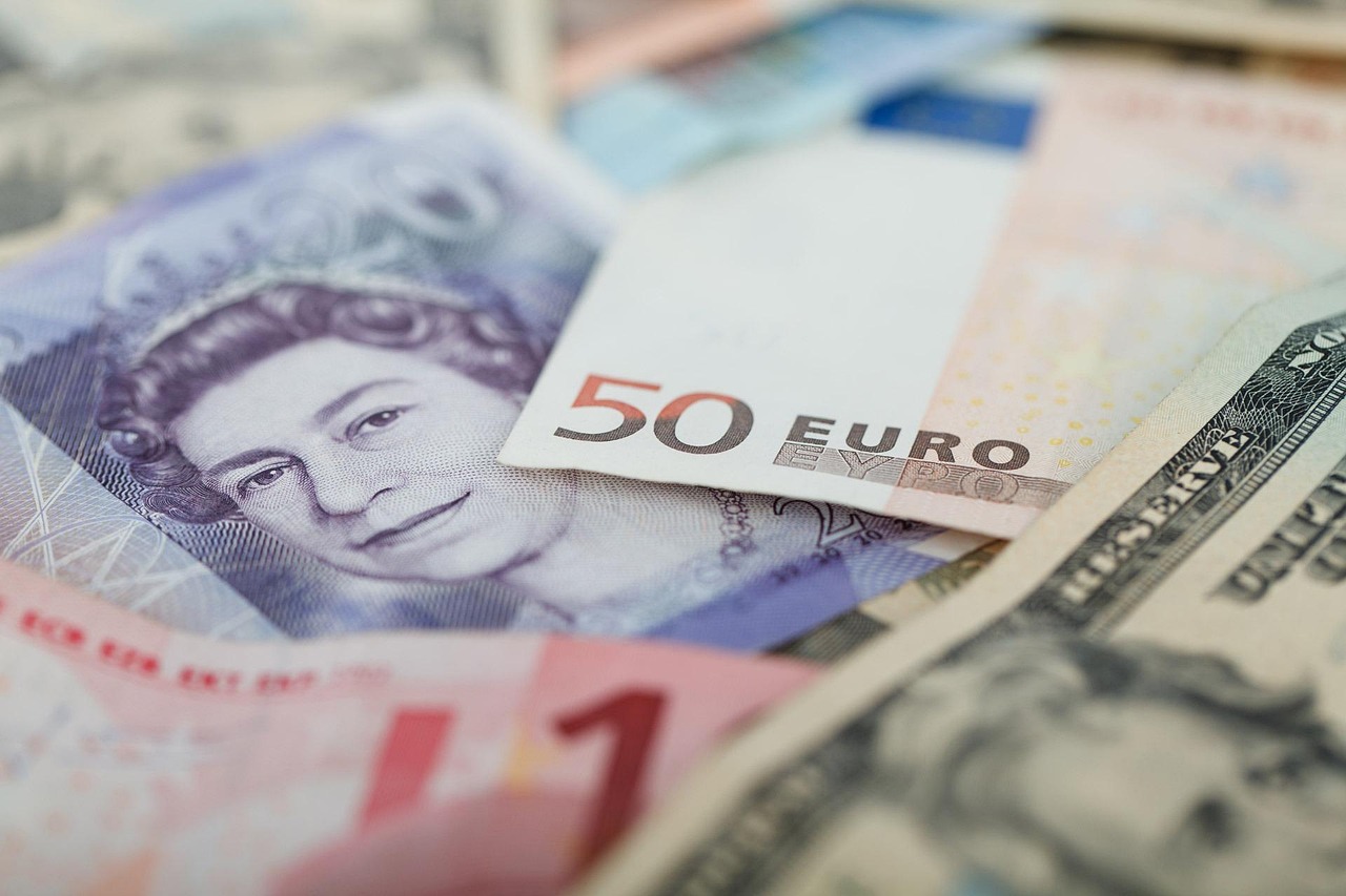 Forex loss in quarterly results: a close-up of mixed foreign currency banknotes, including pound, euro and dollar notes