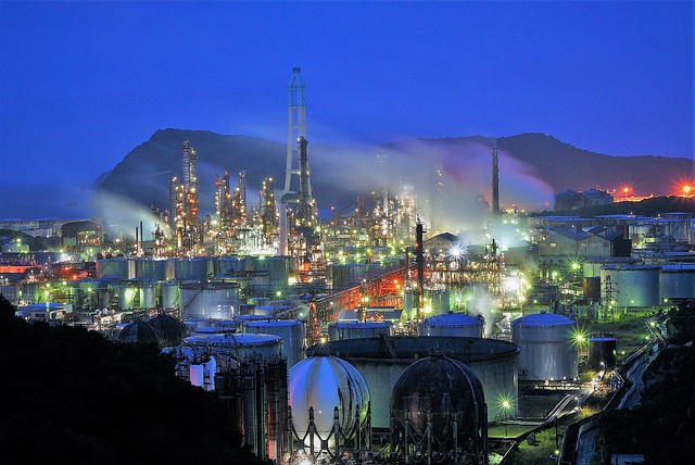 BPCL Q2 results: an oil refinery lit up at night with storage tanks in front