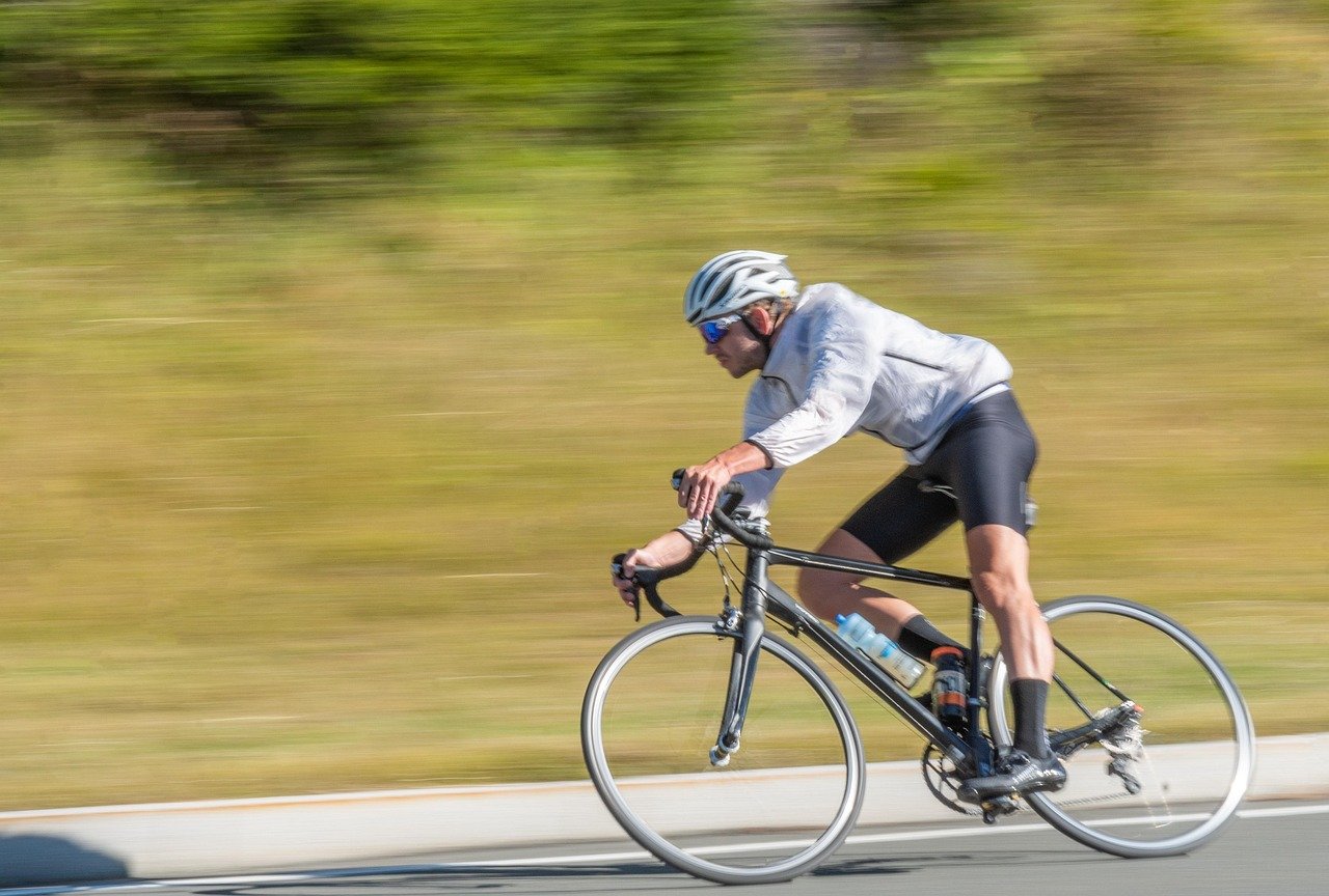 Ease of movement indicator concept: a road cyclist moving fast and smoothly along an open road