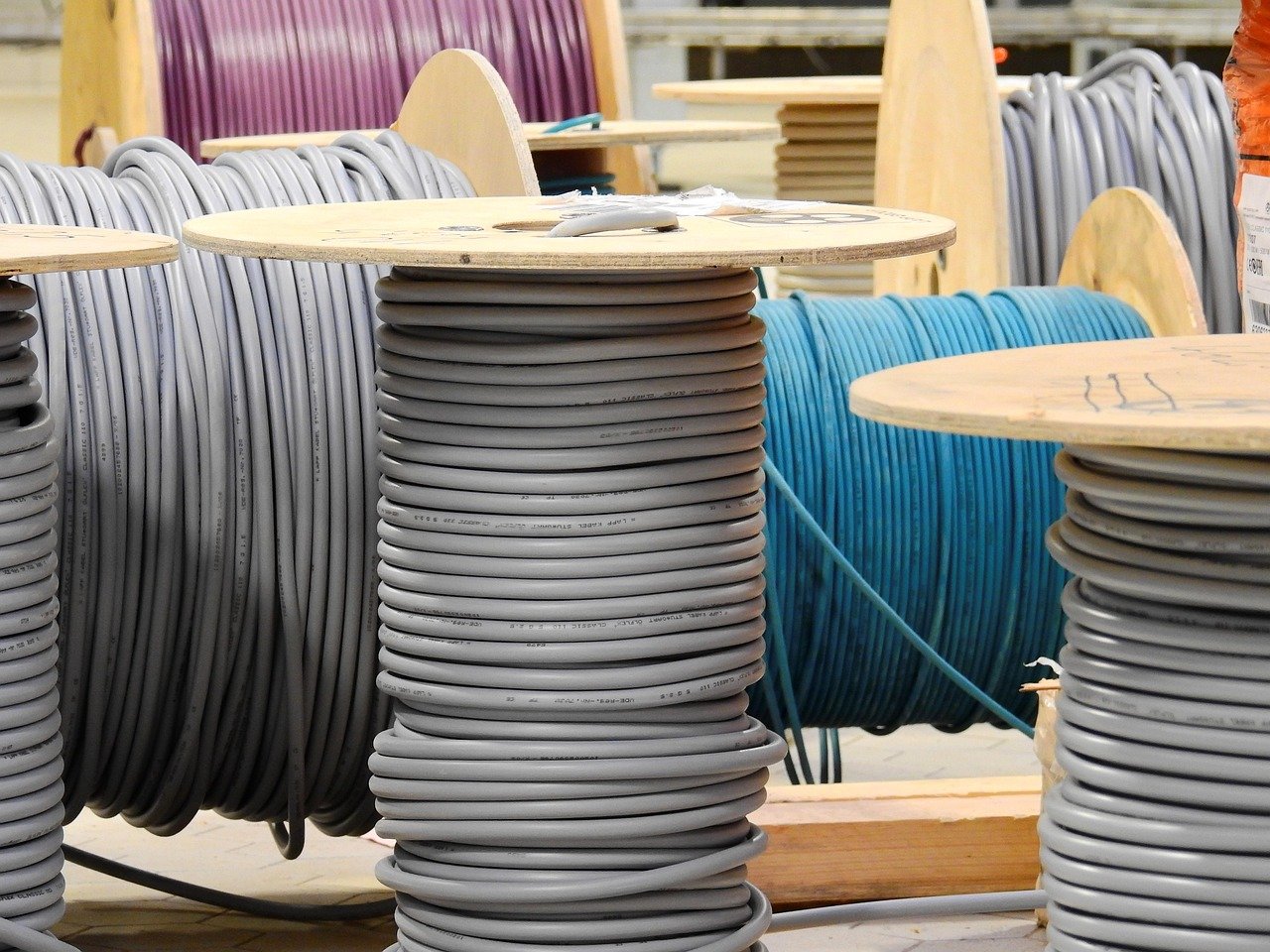 Havells Q2 results: drums of grey and blue electrical cable stacked in a warehouse