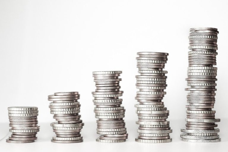 Follow-on public offer concept: five stacks of coins growing taller from left to right, like a listed company adding new shares to its existing base