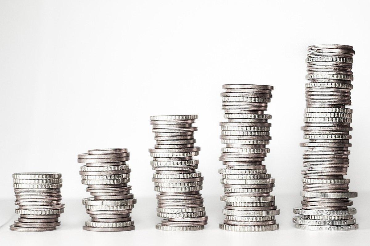 Follow-on public offer concept: five stacks of coins growing taller from left to right, like a listed company adding new shares to its existing base