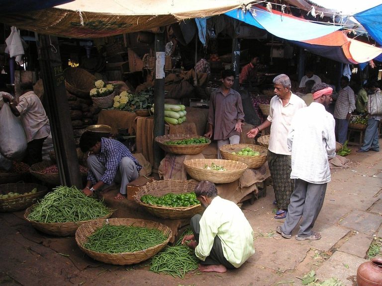 Impact cost on NSE: buyers and sellers at a busy Indian vegetable market, a picture of how liquidity depends on who is ready to trade